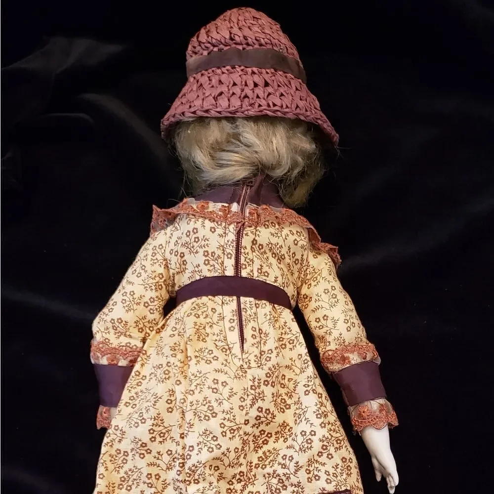 Vintage Porcelain Doll with Brown Dress and Hat